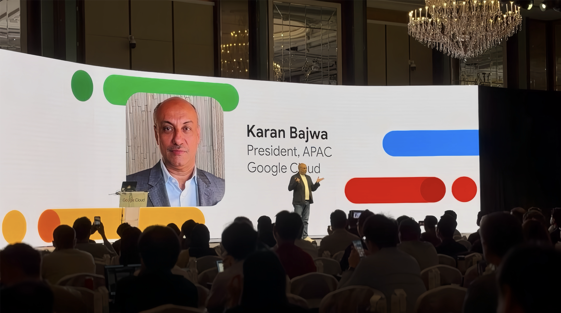 Karan Bajwa speaking on stage to attendees at Google Cloud Startup Summit Singapore 2026